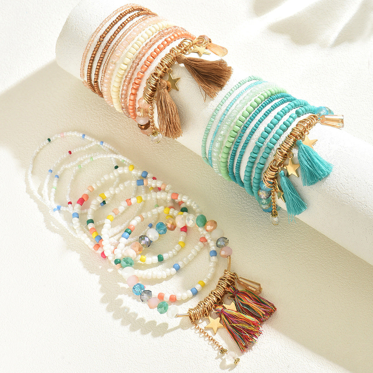 Bracciale donna multistrato bohémien con perline geometriche, nappa e ciondolo a stella