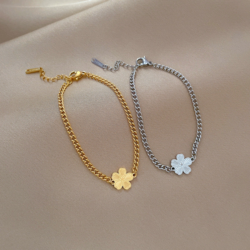 Minimalist Titanium Steel Five-Petal Flower Hand Chain for Women with Gold Plating and Wavy Texture Design