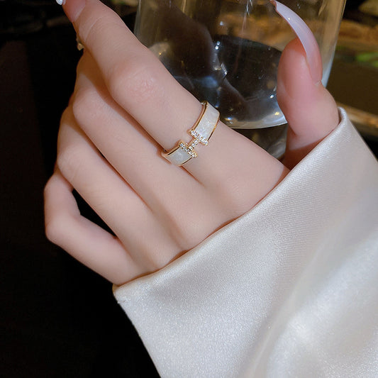 Anello regolabile minimalista a forma di lettera H da donna in acciaio al titanio con placcatura in oro 18 carati