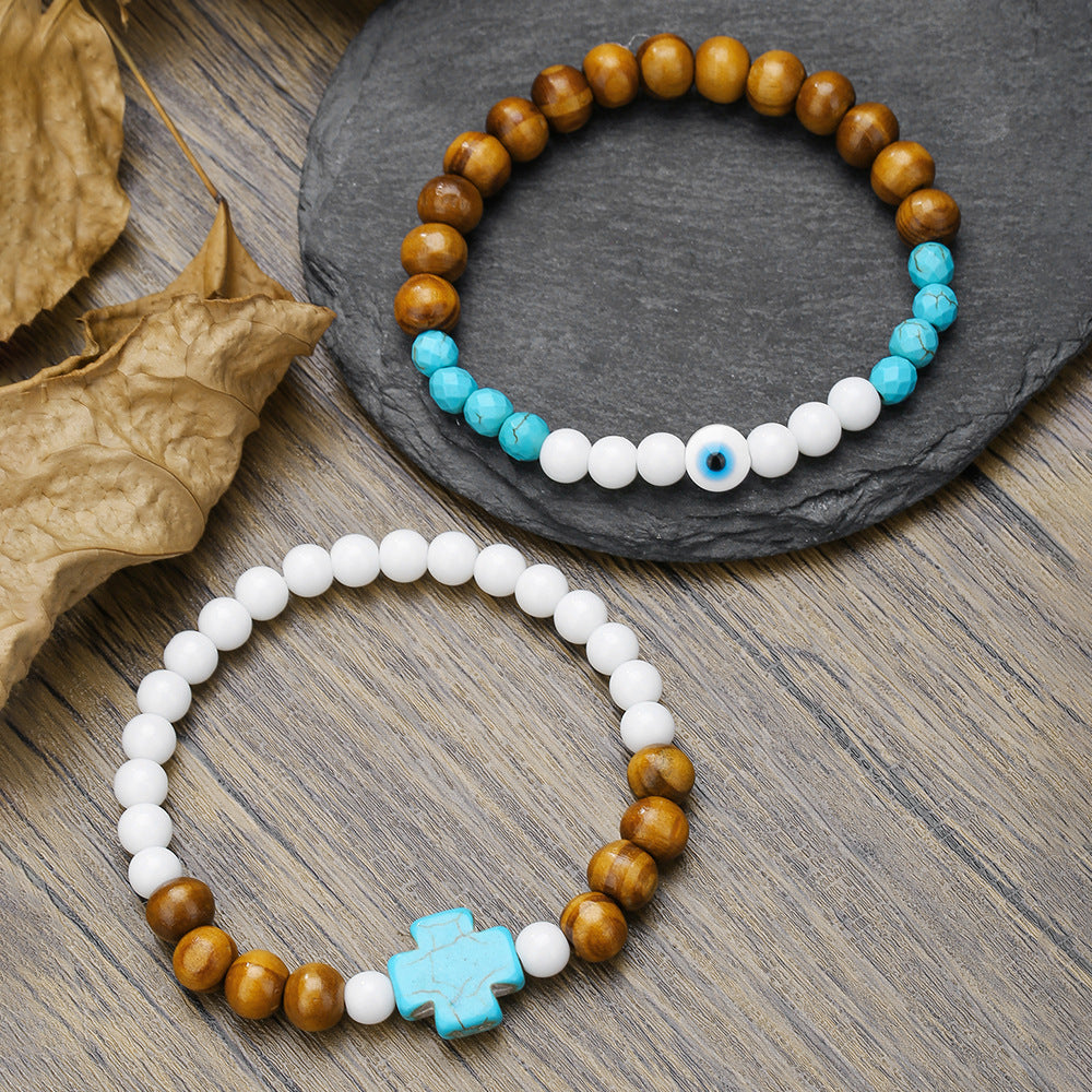 Bracciale Unisex con Perline Turchesi e in Porcellana, Perle in Legno e Ciondolo a Croce Geometrica