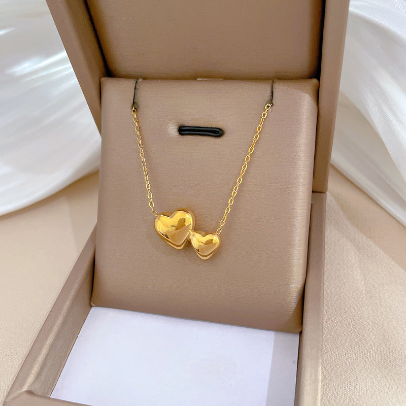 Collana Minimalista Unisex con Doppio Cuore Geometrico in Acciaio al Titanio
