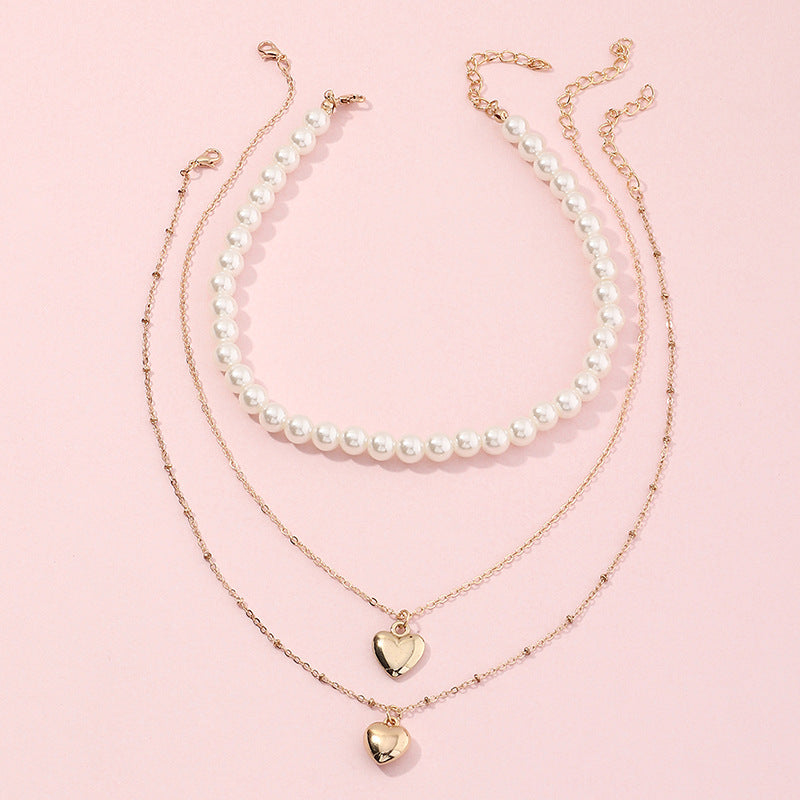 Collar infantil multicapa de inspiración vintage con moneda de perlas y colgante de corazón en cadena de caja para niñas