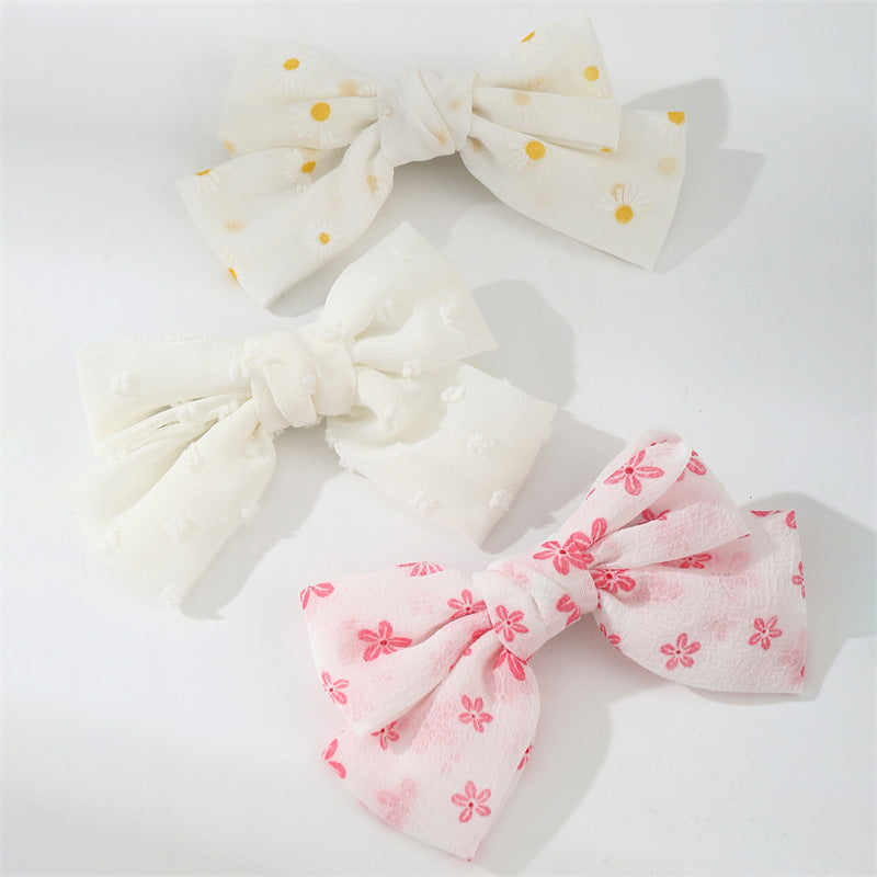 Set di fermagli per capelli minimalisti con fiocco a margherita per bambini in tessuto con palette di colori macaron e texture a maglia