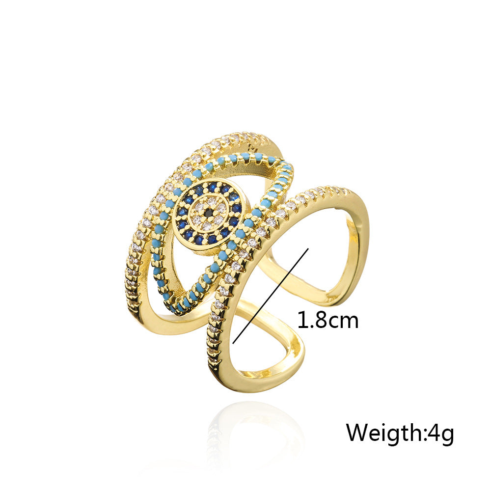 Anello Minimalista Geometrico a Occhio di Allah Traforato per Donna con Base in Rame e Placcatura in Oro con Zirconi Micro-Incastonati