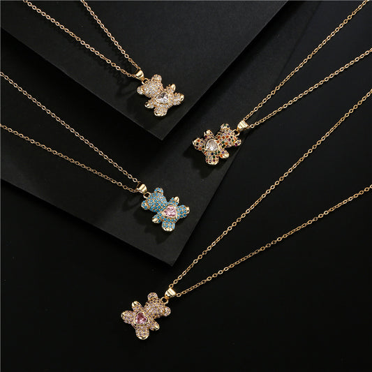 Collar con colgante de oso minimalista en forma de corazón en cobre con circonitas cúbicas micropavé en cadena tipo cola de serpiente