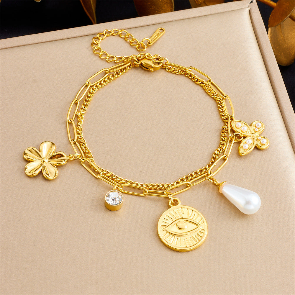 Bracciale con ciondolo floreale e a cuore in stile vintage in acciaio inossidabile con finitura placcata da donna