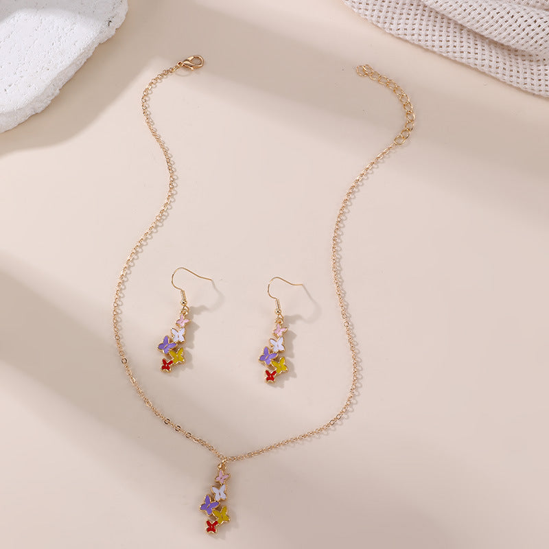 Conjunto de collar con colgante de lazo y mariposa minimalista con acabado esmaltado para niños, joyas de resina en cadena de cuentas