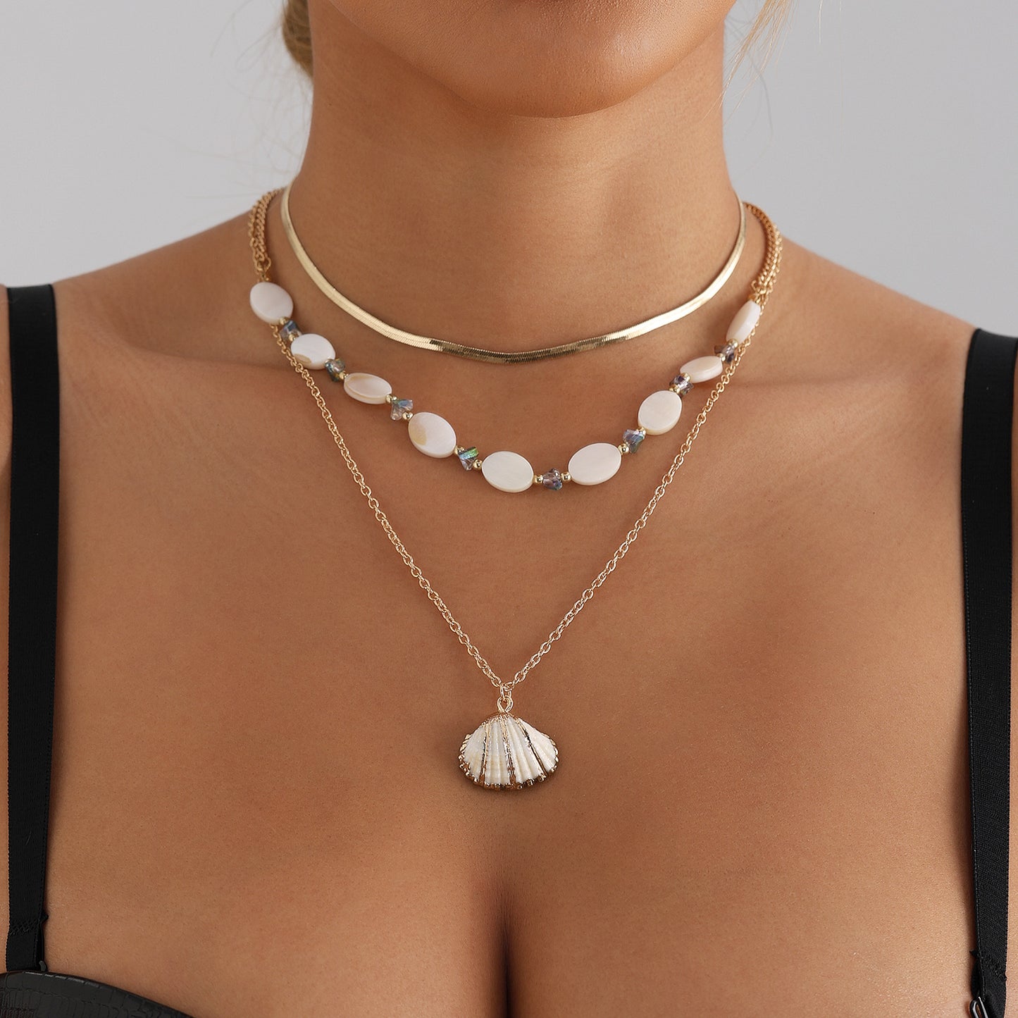 Vintage Ocean-Inspired Multi-Layer Clavicle Necklace with Oval Mother-of-Pearl Beads and Geometric Shell Pendant in Plated Finish