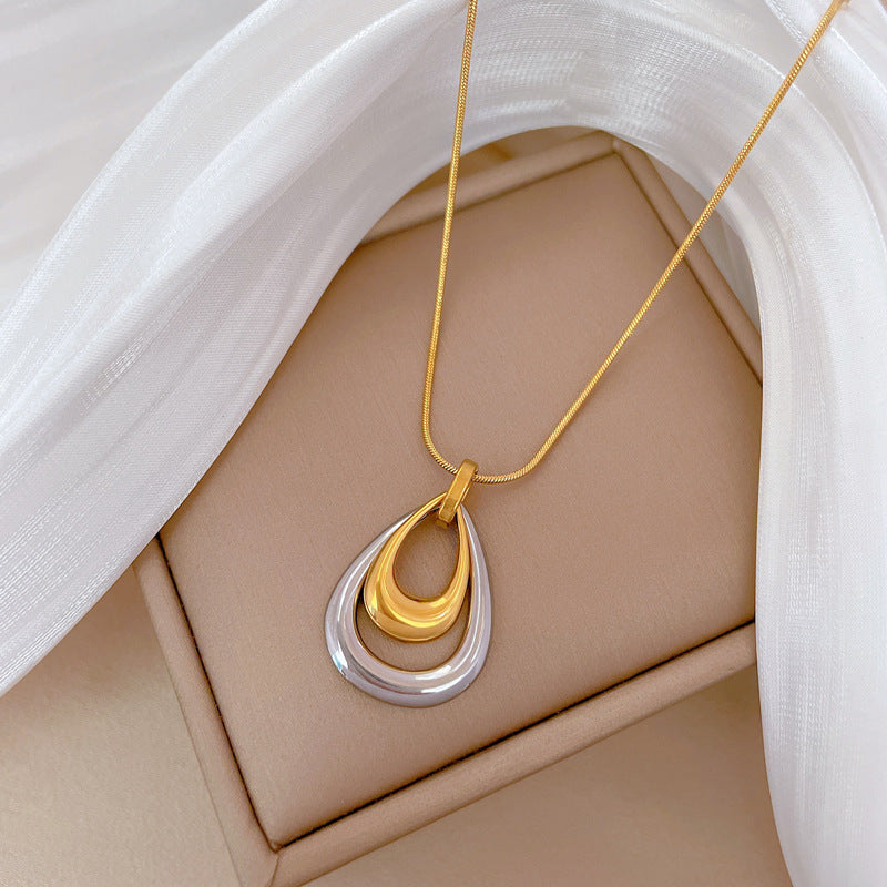 Collana con ciondolo geometrico a goccia minimalista in acciaio al titanio, catena a doppio strato, design floreale botanico, gioielli unisex alla moda per pendolari