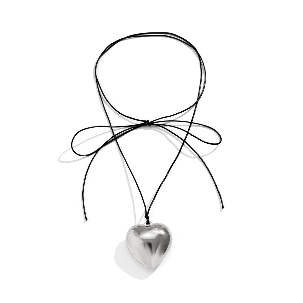 Sweet and Edgy Heart-Shaped Alloy Pendant Necklace with Plated Finish, Long Tassel Design on Velvet Wax Cord for Women