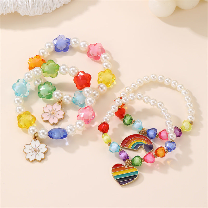 Bracciale per Bambine con Ciondolo a Cuore Floreale e Arcobaleno in Resina Plastica con Perline e Stella