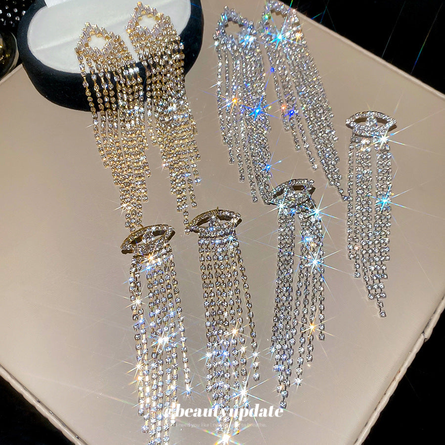 Pendientes colgantes geométricos elegantes en forma de rombo con incrustaciones de circonitas en base de cobre y postes de acero inoxidable para mujer