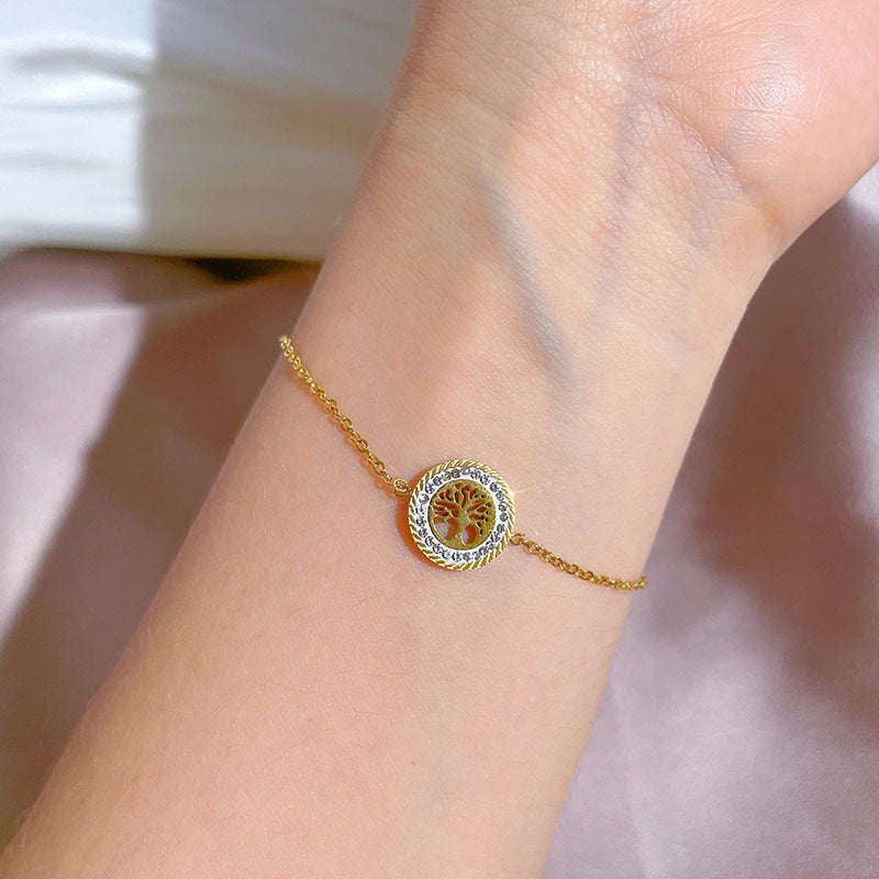Bracciale da donna in stile vintage con disco rotondo "Albero della Vita" in acciaio al titanio con intarsio in strass e placcatura in oro