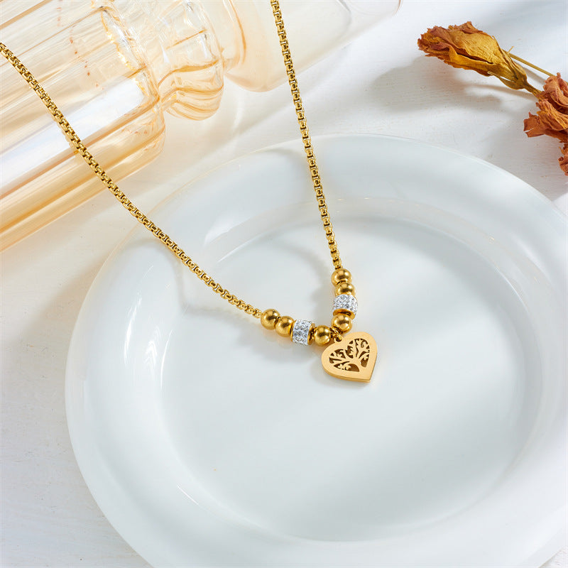 Elegante collar minimalista de acero de titanio con colgante en forma de corazón del Árbol de la Vida, chapado en oro y con cadena de cuentas para mujer