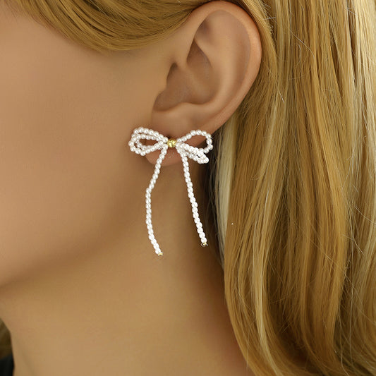 Fashionable Bowknot-Shaped Alloy Ear Studs with Pearl Inlay for Women, Double-Layer Hollow Design Ear Cuffs