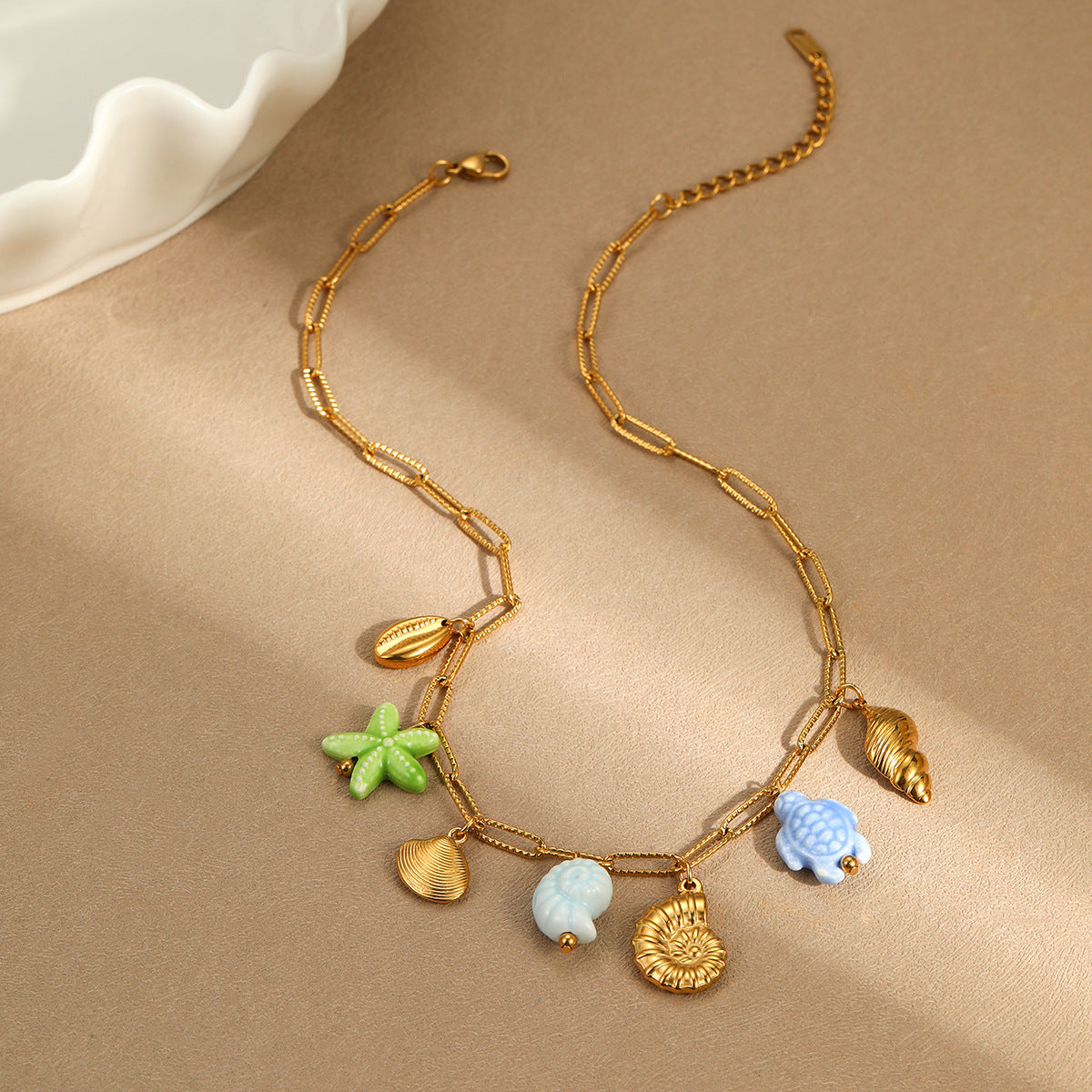 Minimalist Ocean-Inspired Tassel Multi-Pendant Necklace with Starfish and Shell Charms in Stainless Steel with Plated Finish
