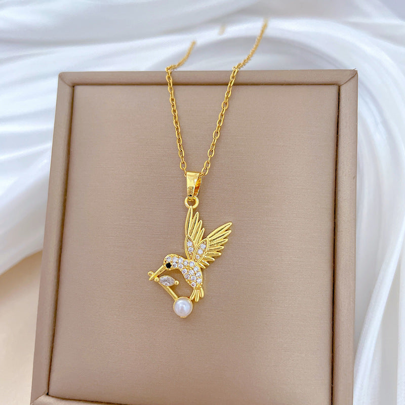 Cartoon Style Swallow-Shaped Pearl Pendant Necklace for Women with Rhinestone Accents on Titanium Steel Chain