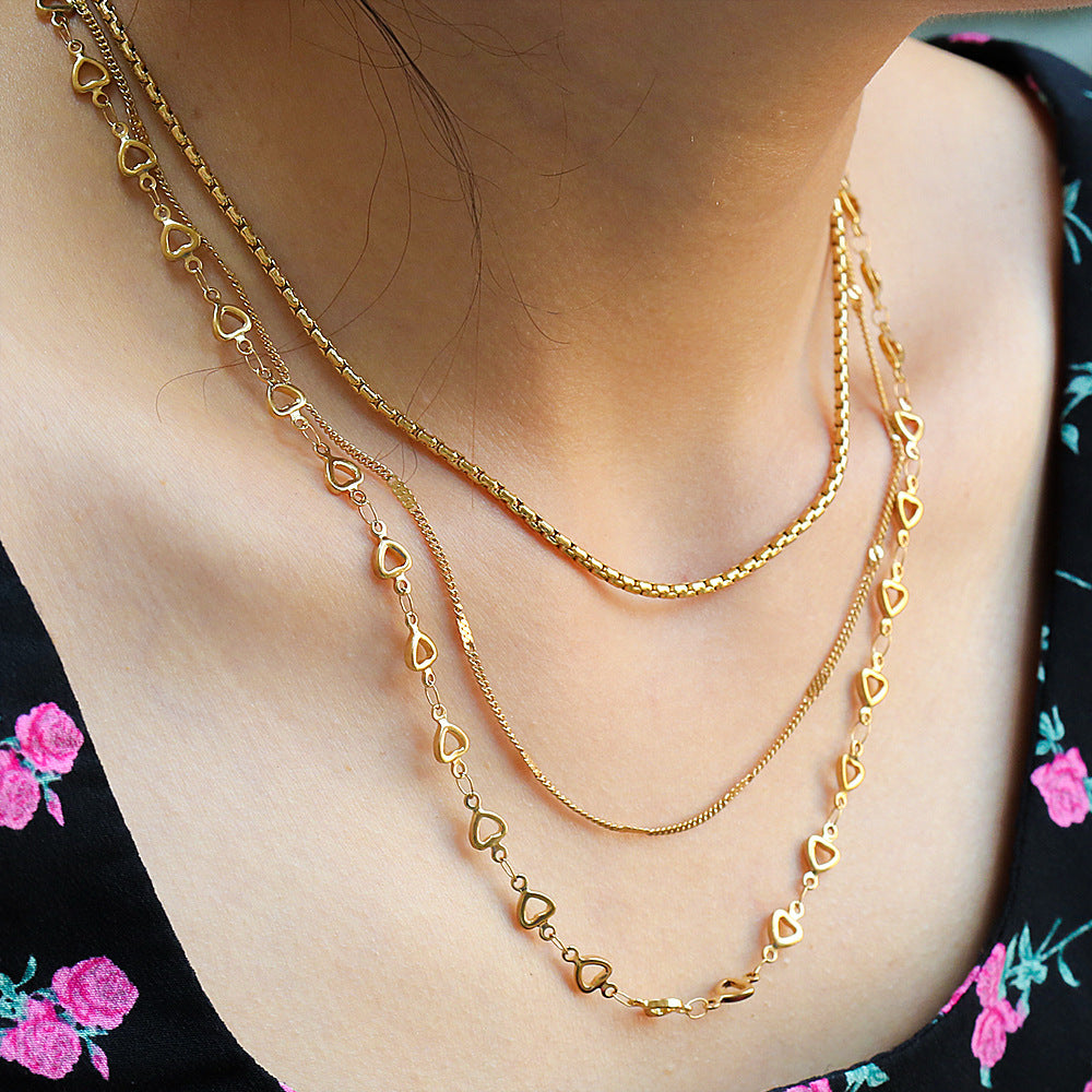 Collar en capas de corazón minimalista de acero de titanio chapado en oro de 18 quilates para mujer