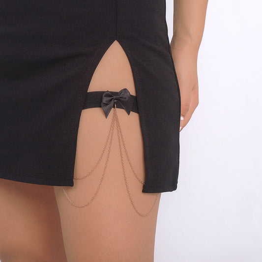 Elegante tobillera ajustable con lazo de mariposa, borlas y detalles de cadena para mujer