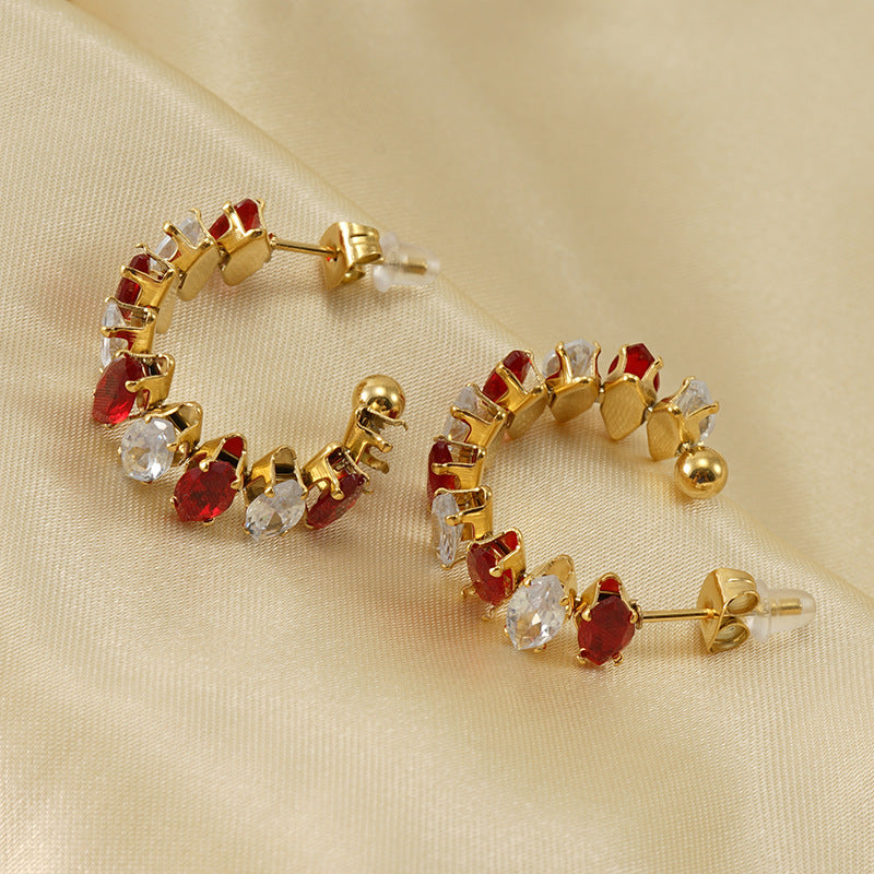 Orecchini a perno da donna alla moda geometrici in acciaio al titanio placcato oro 18K con zirconi