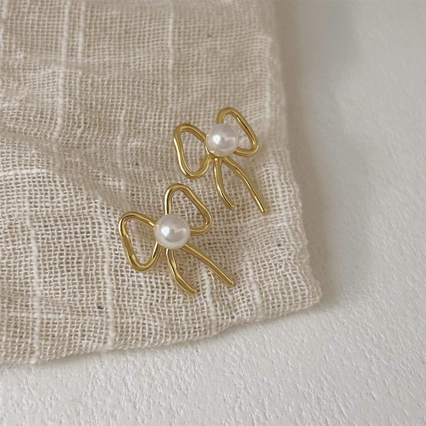 Minimalist Bowknot Pearl Stud Earrings in 925 Sterling Silver with Gold Plating