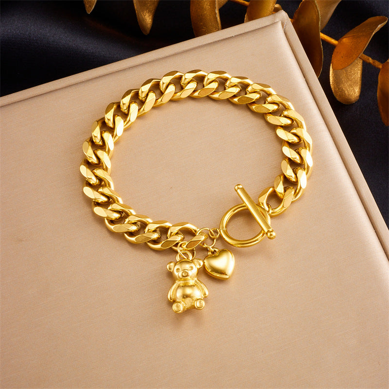 Bracciale da donna placcato oro in acciaio inossidabile con ciondoli a orsetto e cuore e chiusura a moschettone
