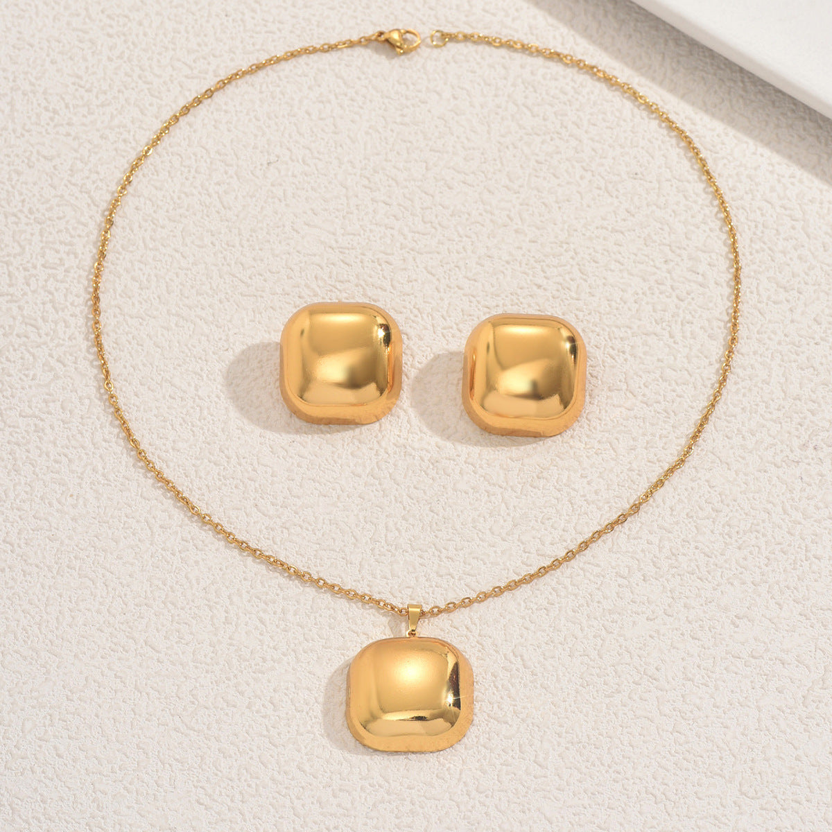 Set di collana e orecchini a pendente a cuore geometrico in lega con finitura placcata per donna