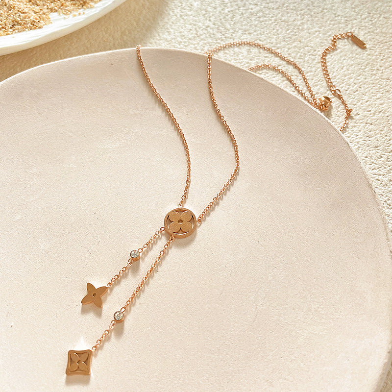 Minimalist Luxury Hollow Four-Leaf Clover Tassel Titanium Steel Necklace