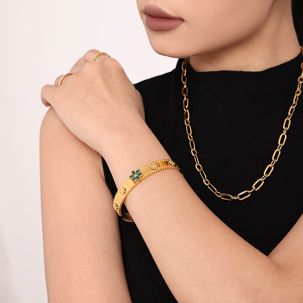 Pulsera de acero inoxidable con forma de copo de nieve y rueda de la fortuna, con incrustaciones de circonita y chapado en oro de 18 quilates.
