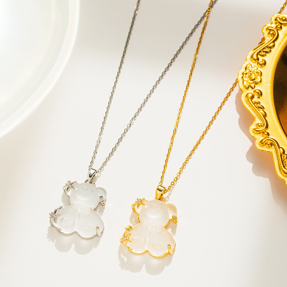 Collana pendente minimalista orsetto e stella da donna in acciaio al titanio placcato oro con catena a maglie ovali