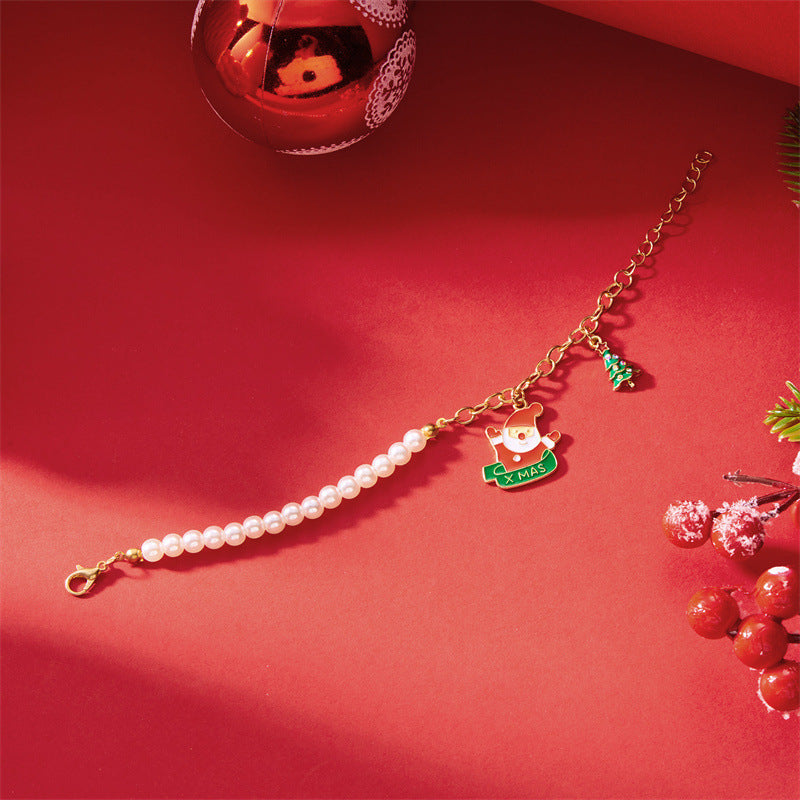 Pulsera de abalorios de Papá Noel de moda para mujer, chapada en aleación con acabado de esmalte, diseño de personaje de dibujos animados, joyería temática navideña