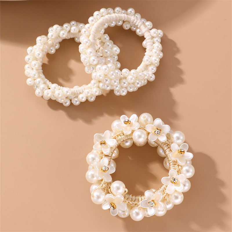 Juego de gomas de pelo florales minimalistas para niños con detalles de perlas y estructura de resina