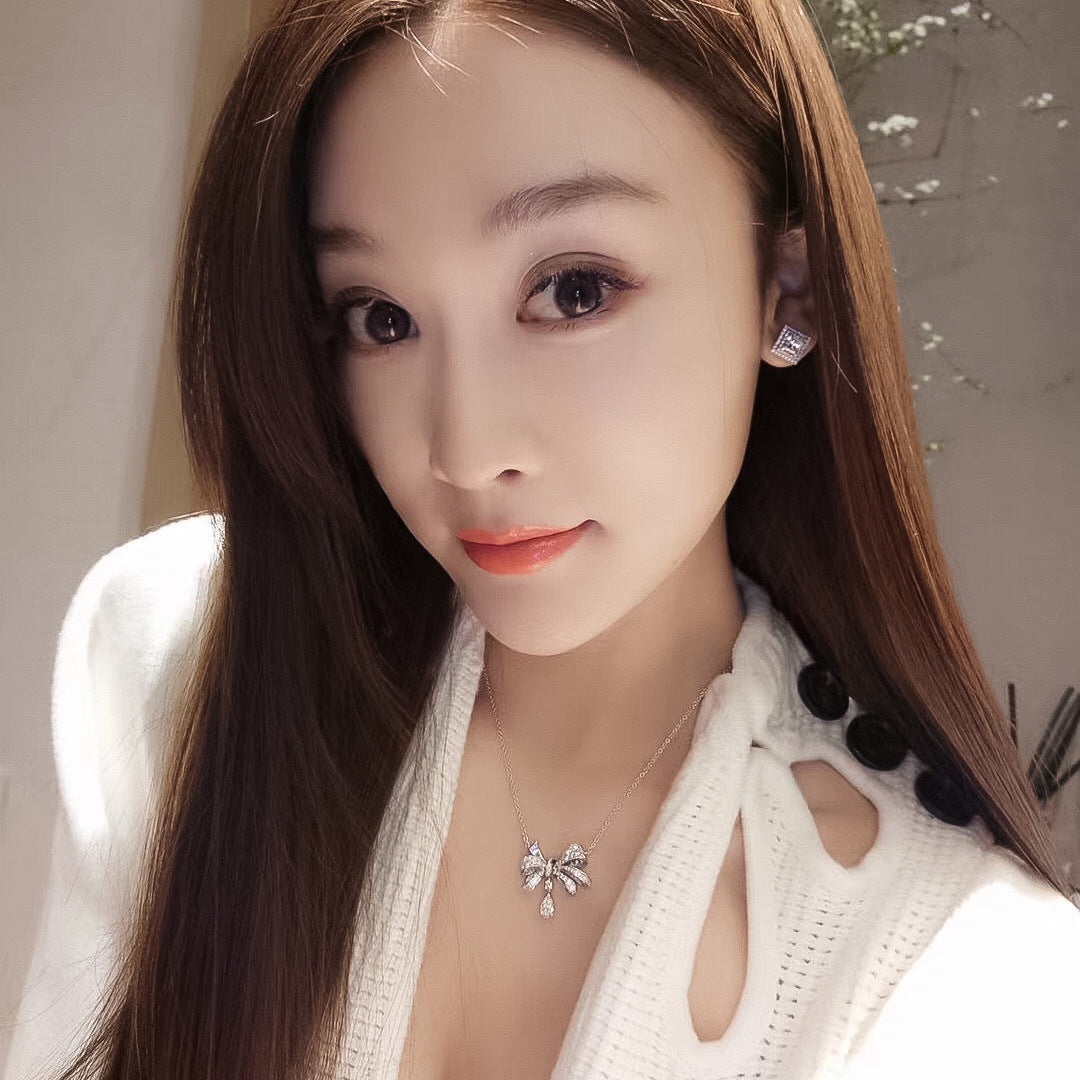 Sweet and Edgy Bow-Shaped Titanium Steel Necklace with Rhinestone Inlay for Women and Men