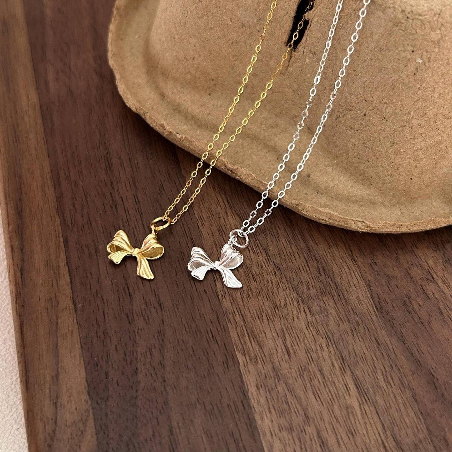 Minimalist Bow Knot Pendant Necklace in 925 Sterling Silver with Plated Finish on Cross Chain