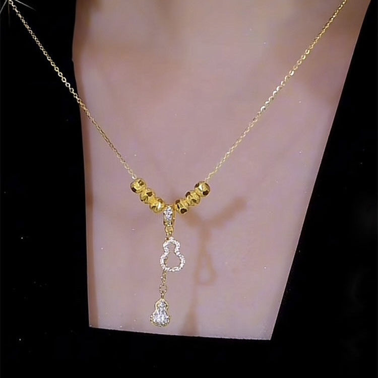 Collana Minimalista in Acciaio al Titanio a Forma di Fiore con Ciondolo in Rame Placcato Oro e Dettaglio Nappa per Uomo e Donna
