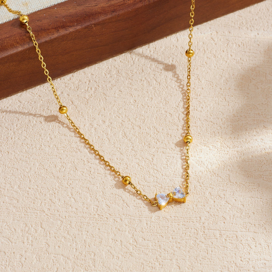 Minimalist Gold Plated Stainless Steel Rhinestone Bow Pendant Necklace and Earring Set for Women