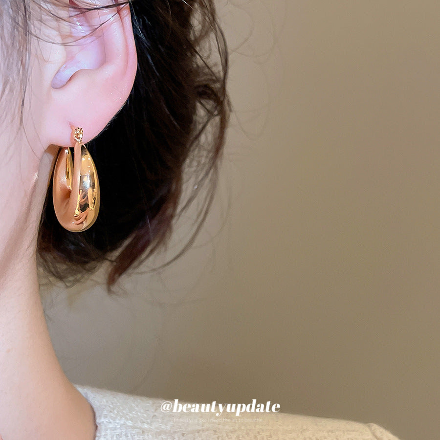 Pendientes de botón redondos geométricos minimalistas para mujer en metal chapado con acabado pulido elegante