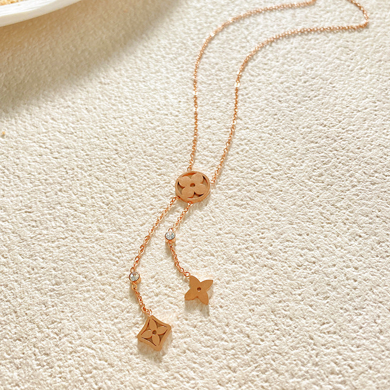Minimalist Luxury Hollow Four-Leaf Clover Tassel Titanium Steel Necklace