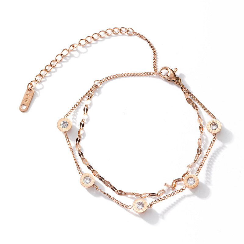 Bracciale minimale geometrico in acciaio al titanio con placcatura in oro rosa e singolo strass per donna