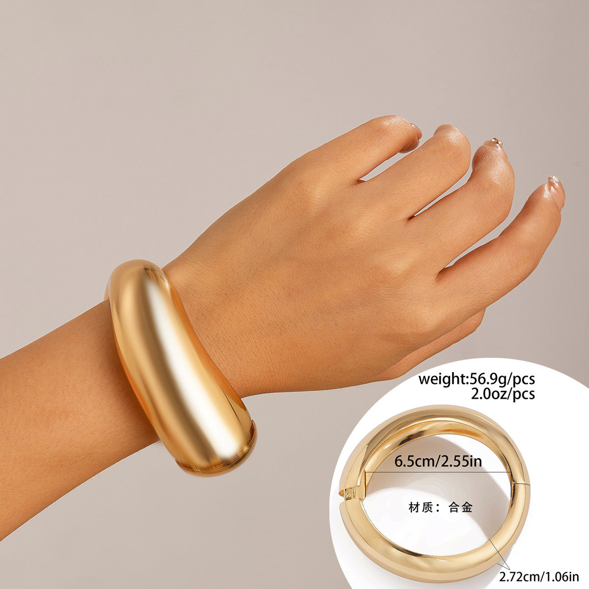 Bracciale a manetta in metallo lucidato a forma di goccia d'acqua oversize con finitura a specchio e design geometrico