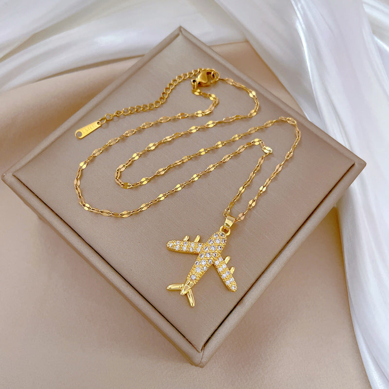 Collar con colgante de avión de combate de lujo con diamantes de imitación para mujer y hombre, cadena de eslabones geométrica de acero de titanio con motivo de luna