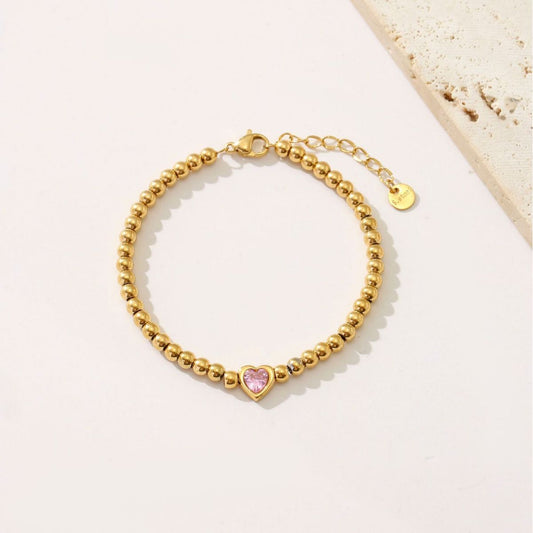 Bracciale in acciaio al titanio a forma di cuore stile INS da donna con intarsi in strass e finitura placcata