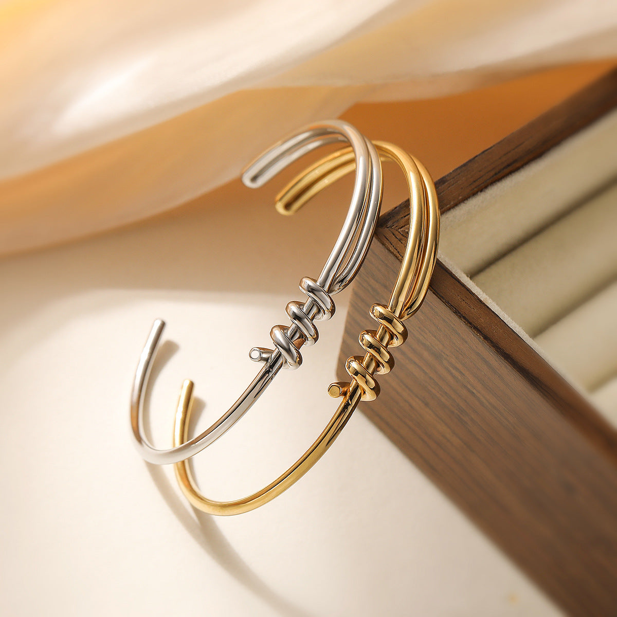 Minimalist C-Shaped Stainless Steel Bracelet for Women with 18K Gold Plating and Asymmetrical Knot Detail