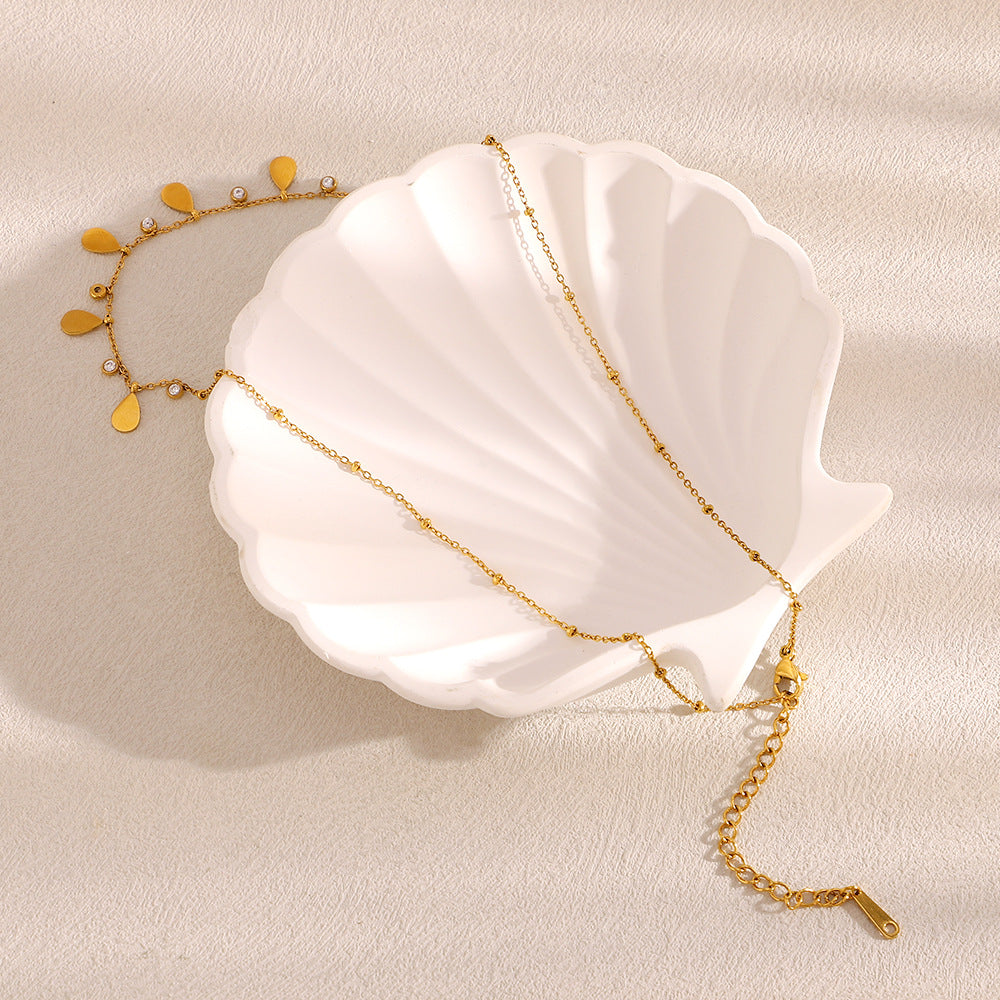 Collana pendente minimalista in acciaio inossidabile a forma di goccia con placcatura in oro 18K e intarsio di zirconi per donne