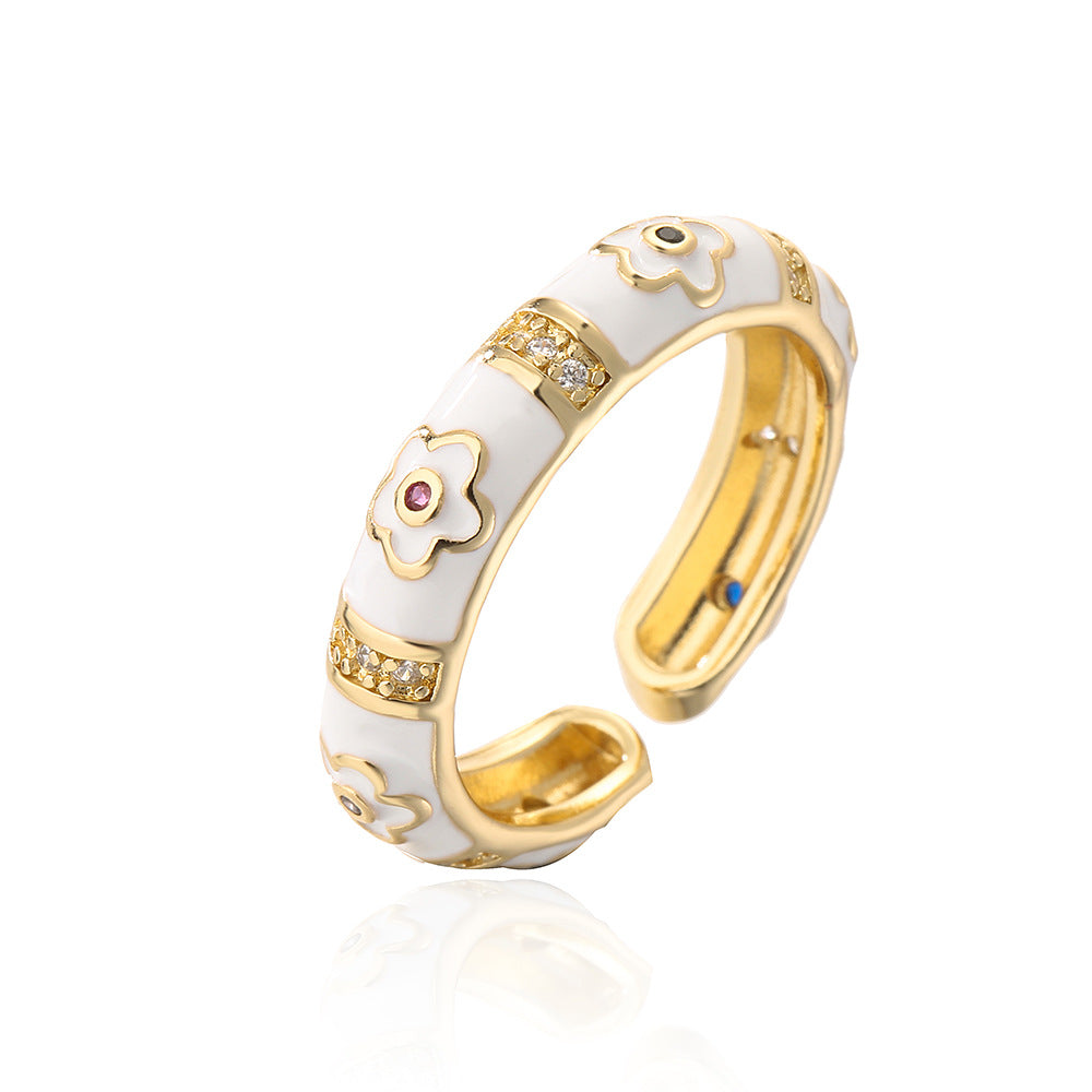 Anillo de flores geométricas irregulares estilo bohemio para mujer, hecho de cobre con chapado en oro de 18 quilates y acabado esmaltado