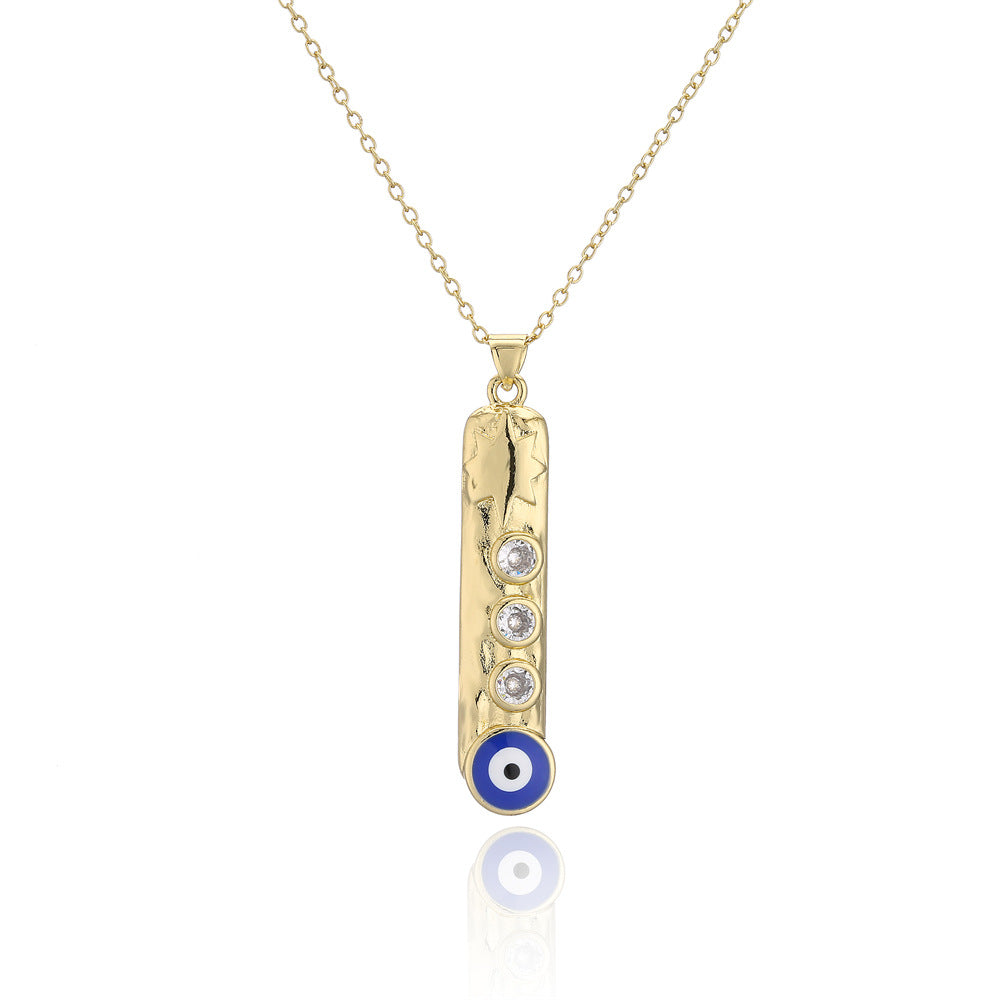 Collana con ciondolo a barra verticale geometrica con base in rame e placcatura in vero oro, design smaltato a occhio turco
