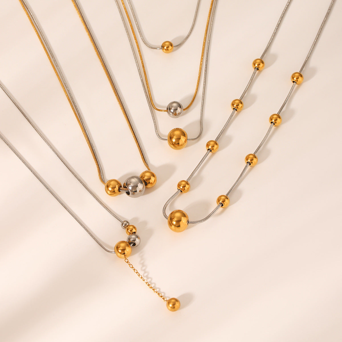 Minimalist Geometric Round Bead Pendant Necklace for Women in Stainless Steel with Titanium Steel Charm and Gold Plated Snake Chain