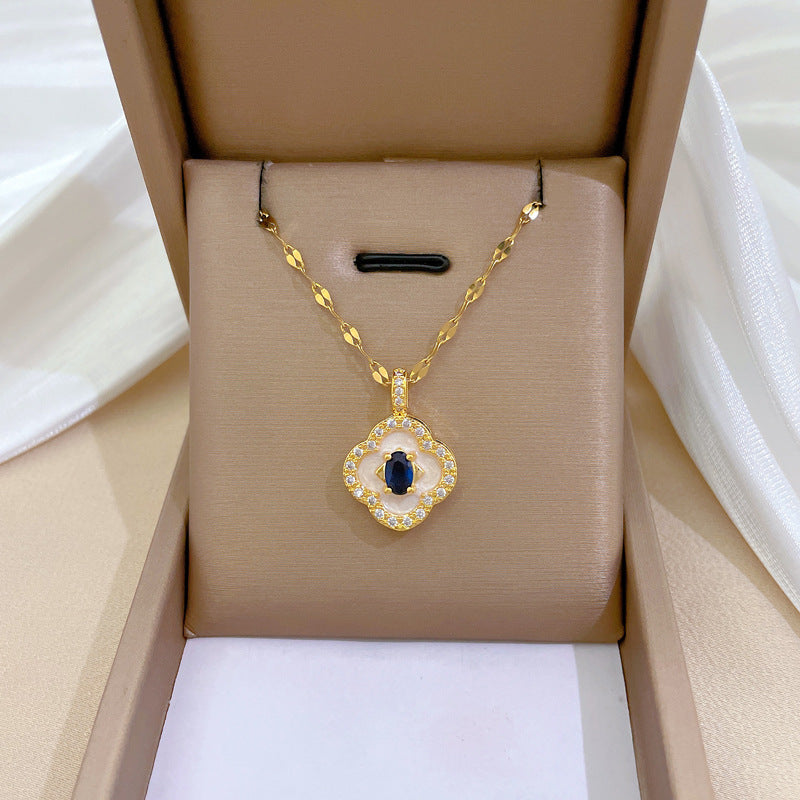 Collana con ciondolo a luna geometrica minimalista per donna e uomo, catena in acciaio inossidabile con elegante motivo a conchiglia e quadrifoglio