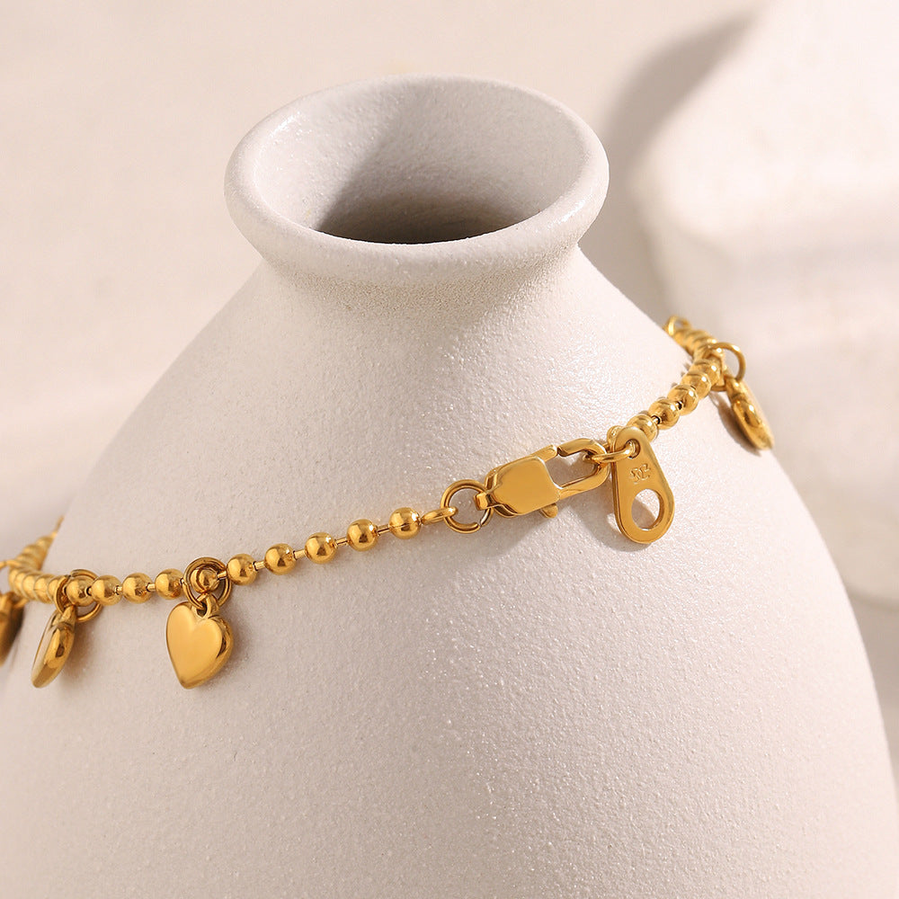 Elegante bracciale con perline a forma di cuore minimalista in acciaio inossidabile placcato oro 18 carati da donna