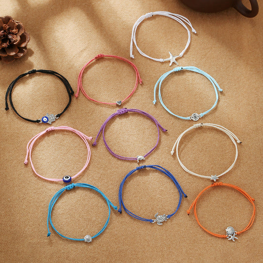 Conjunto de tobillera y pulsera trenzada con estilo de vacaciones en la playa, con dije de tortuga, brújula, concha, corazón, estrella de mar y ojo turco de aleación